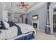 Main bedroom with a fireplace, tv, light walls, and access to the outdoor pool area at 259 Golden Harbour Trl, Bradenton, FL 34212
