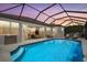 Inviting screened-in pool area with ample seating for relaxing and entertaining at 259 Golden Harbour Trl, Bradenton, FL 34212