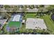 Aerial view of the bocce ball court, and sand volleyball courts in a well manicured community at 259 Golden Harbour Trl, Bradenton, FL 34212