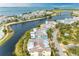 Aerial view of waterfront community with colorful homes and a scenic waterway at 282 Sapphire Lake Drive Dr # 201, Bradenton, FL 34209