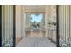 Inviting foyer leading to a bright living area with views of the lanai at 3153 Founders Club Dr, Sarasota, FL 34240