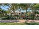 Beautiful home showcasing a tile roof, tower entry, and meticulously maintained landscaping at 3153 Founders Club Dr, Sarasota, FL 34240