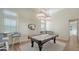 Games room featuring a pool table, custom lighting, and stylish decor at 3153 Founders Club Dr, Sarasota, FL 34240