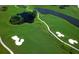 Aerial view of a well-maintained golf course with ponds, sand traps, and manicured fairways at 3153 Founders Club Dr, Sarasota, FL 34240