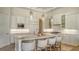 A gourmet kitchen featuring white cabinets, a large center island, and modern stainless steel appliances at 3153 Founders Club Dr, Sarasota, FL 34240