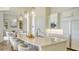 Open kitchen with a large island, stainless steel appliances, and seamless flow into the living area at 3153 Founders Club Dr, Sarasota, FL 34240