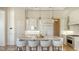 Kitchen island featuring bar stool seating, ample counter space, and modern appliances at 3153 Founders Club Dr, Sarasota, FL 34240