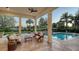 Picturesque patio with seating, a coffee table, and a stunning pool view, ideal for relaxation at 3153 Founders Club Dr, Sarasota, FL 34240