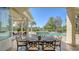 Covered patio with a dining area and views of the pool and a manicured backyard at 3153 Founders Club Dr, Sarasota, FL 34240