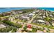 Aerial view showing the property's location near a commercial area at 4002 6Th Ave, Holmes Beach, FL 34217