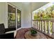 Balcony with outdoor seating, overlooking lush tropical foliage at 4002 6Th Ave, Holmes Beach, FL 34217