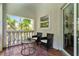 Balcony seating area with lush view at 4002 6Th Ave, Holmes Beach, FL 34217