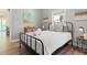 Cozy bedroom with natural light, beach themed decor, and laminate flooring at 4002 6Th Ave, Holmes Beach, FL 34217