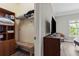 Bedroom closet with shelving, wooden storage, and laminate flooring at 4002 6Th Ave, Holmes Beach, FL 34217