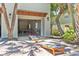Open garage with ping pong table, bikes, and two cornhole games at 4002 6Th Ave, Holmes Beach, FL 34217