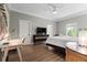 Bedroom with hardwood floors, ceiling fan, and desk area at 4002 6Th Ave, Holmes Beach, FL 34217
