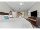Spacious bedroom featuring a ceiling fan, wooden floors and a queen-size bed at 4002 6Th Ave, Holmes Beach, FL 34217