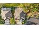 Aerial view of the property, highlighting the roof, landscaping, and proximity to neighboring houses at 411 28Th W St, Palmetto, FL 34221