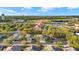A bird's eye shot displays the property, neighboring homes, and community features at 411 28Th W St, Palmetto, FL 34221