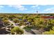 An aerial view of the community displaying the property's location, adjacent houses, and greenery at 411 28Th W St, Palmetto, FL 34221