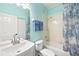 Bright bathroom with a white vanity, tiled shower, and ample space for relaxation at 411 28Th W St, Palmetto, FL 34221