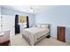 Cozy bedroom features natural light, ceiling fan, and neutral decor for a calming space at 411 28 W St, Palmetto, FL 34221