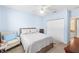 Relaxing bedroom includes a ceiling fan, natural light, and ample closet space at 411 28Th W St, Palmetto, FL 34221