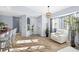 Bright and airy living space with wood-style floors, decorative arches, and stylish furniture, creating an inviting atmosphere at 411 28Th W St, Palmetto, FL 34221