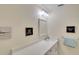 Bathroom with white countertops, framed mirror and humorous wall decorations for a cozy feel at 4307 Gulf Dr # 202, Holmes Beach, FL 34217