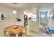 Bright dining area adjacent to a modern kitchen with stainless steel appliances at 4307 Gulf Dr # 202, Holmes Beach, FL 34217