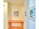 Hallway with coastal-themed artwork and a console table at 4307 Gulf Dr # 202, Holmes Beach, FL 34217