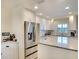 Updated kitchen with stainless steel appliances and granite countertops at 4307 Gulf Dr # 202, Holmes Beach, FL 34217