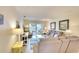 Comfortable and well-lit living room with a balcony at 4307 Gulf Dr # 202, Holmes Beach, FL 34217