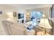 Cozy living room with comfortable seating and sliding glass doors to the balcony at 4307 Gulf Dr # 202, Holmes Beach, FL 34217