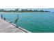 Stunning view of the ocean as a heron stands on the edge of a pier railing at 4307 Gulf Dr # 202, Holmes Beach, FL 34217