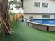 This backyard features a pool, artificial turf, and a home at 4705 Hollingsworth Ave, Sarasota, FL 34233