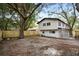 Large backyard featuring mature trees and new wooden fence at 4705 Hollingsworth Ave, Sarasota, FL 34233