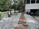 Beautifully landscaped backyard with stone walkway at 4705 Hollingsworth Ave, Sarasota, FL 34233