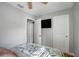 Cozy bedroom offering a ceiling fan and convenient access to a TV at 4705 Hollingsworth Ave, Sarasota, FL 34233