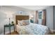 Relaxing bedroom with a rattan headboard, decorative pillows, and coordinated lamps at 4705 Hollingsworth Ave, Sarasota, FL 34233