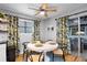 Charming dining area with a round table, stylish chairs, and bright natural light at 4705 Hollingsworth Ave, Sarasota, FL 34233