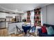Bright dining area featuring a table with chairs and an open-concept layout with a view of the kitchen at 4705 Hollingsworth Ave, Sarasota, FL 34233