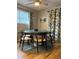 Dining room featuring wood table and chairs and decorative curtains at 4705 Hollingsworth Ave, Sarasota, FL 34233