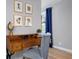 Inviting home office with a wooden desk, stylish chair, and natural light from the window at 4705 Hollingsworth Ave, Sarasota, FL 34233