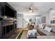 Inviting living room with a cozy fireplace, comfortable seating, and stylish decor, perfect for relaxation and entertaining at 4705 Hollingsworth Ave, Sarasota, FL 34233