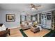 Comfortable living room with stylish decor, hardwood floors, and lots of natural light at 4705 Hollingsworth Ave, Sarasota, FL 34233