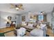 Open floor plan featuring a living room with ample seating, a dining area, and a glimpse of the kitchen at 4705 Hollingsworth Ave, Sarasota, FL 34233