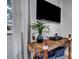 Cozy room with a unique wooden table and decorative plant with window view at 4705 Hollingsworth Ave, Sarasota, FL 34233