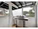 Enclosed patio area with stainless steel gas grill at 4705 Hollingsworth Ave, Sarasota, FL 34233