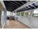 Enclosed sunroom features durable flooring, ample light, and an outdoor view, offering a versatile space for relaxation at 4705 Hollingsworth Ave, Sarasota, FL 34233